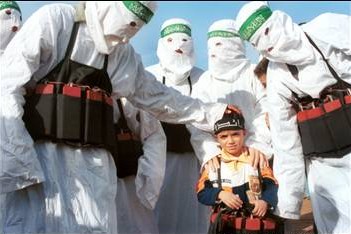 Hamas terrorists teach the art of suicide bombing to a 5-year-old. (Israel News Agency)